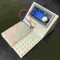 Mounting stand for ZK-4KX voltage regulator, featuring a dedicated slot for a breadboard and a general-purpose perforated area