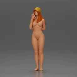 naked girl holding a phone on the beach and wearing a cap