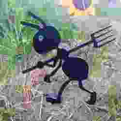 Garden figure of an ant with a pitchfork